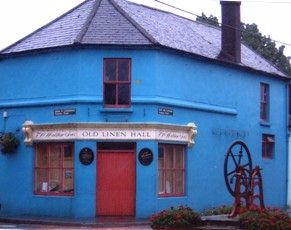 The Old Linen Hall in Clonakilty, Co Cork, with Spinning Wheel outside.